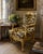 A striking French Regency style armchair, distinguished by its hand-carved giltwood frame and newly upholstered in the...