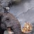 This work presents a surreal landscape where an elephant, engulfed in flames, stands majestically in a tranquil body of...