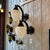 Pair of Original Art Deco exterior wall sconces. Featuring Opal Satin Acorn Glass Shades and Cast Bronze stepped geometric...