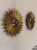 This product is a pair of vintage French gilt bronze sunburst mirrors, perfect for adding a touch of retro charm to any...