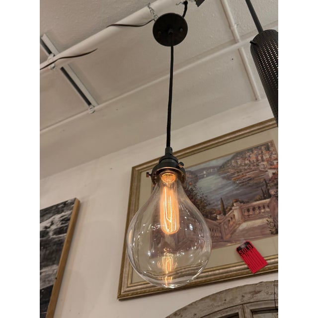 Design Plus Gallery presents a Teardrop Pendant Light from Restoration Hardware. This pendant pairs a clear blown-glass...