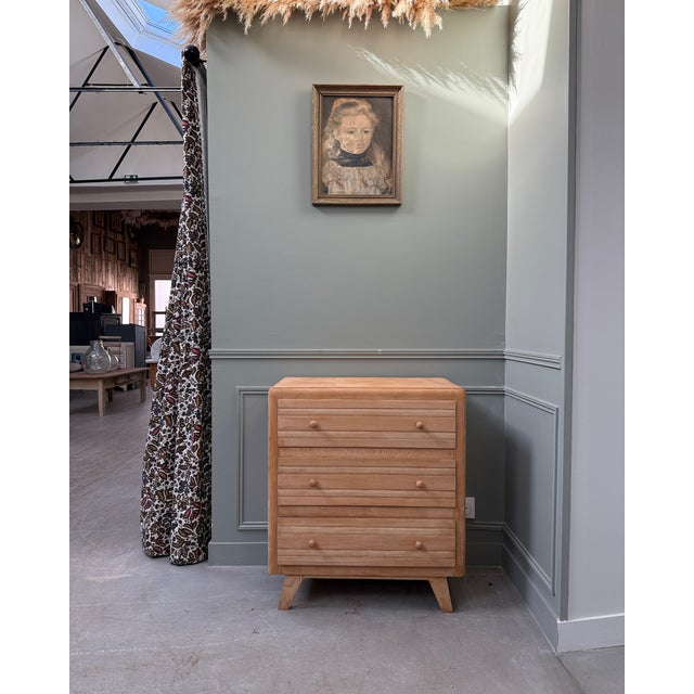 An iconic piece of post-war french furniture, this three-drawer chest embodies the popular modernism of the 1950s: clean,...