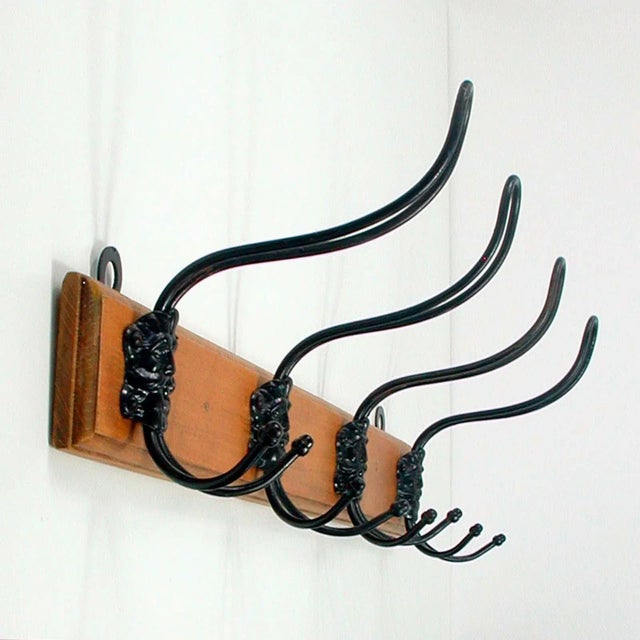 This cottage style coat hanger was manufactured in German in the 1920s. It is made of wood (I assume pine wood) and has...