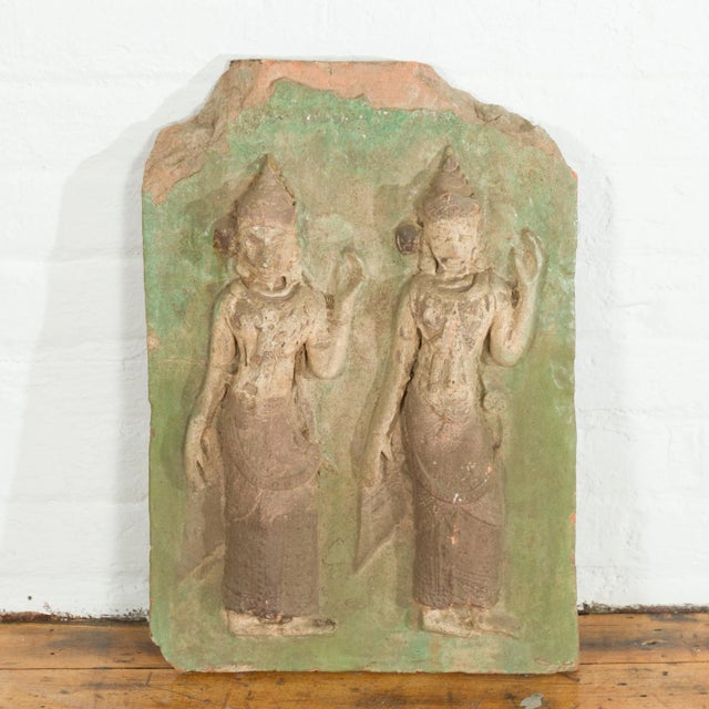 A Thai carved stone temple wall plaque depicting two ceremonial dancers with green accents. hand carved in Thailand, this...