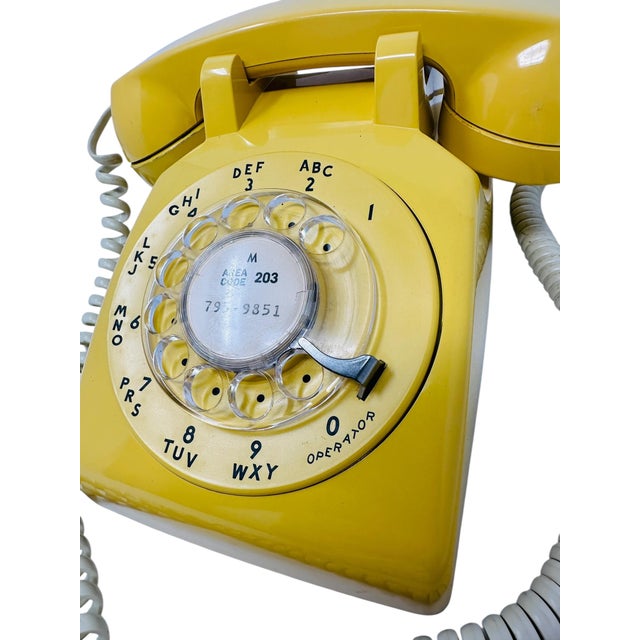 This iconic piece of American history is a genuine Western Electric Model 500DM rotary desk telephone, a classic workhorse...