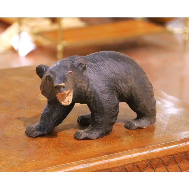 This expressive hand-carved walnut bear sculpture was crafted in Japan circa 1970. Sculpted from solid walnut, the figure...
