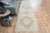 Vintage Hand-Knotted runner rug is a semi-antique vintage area rug. The '70s Eastern region of Anatolia's unique rug is...