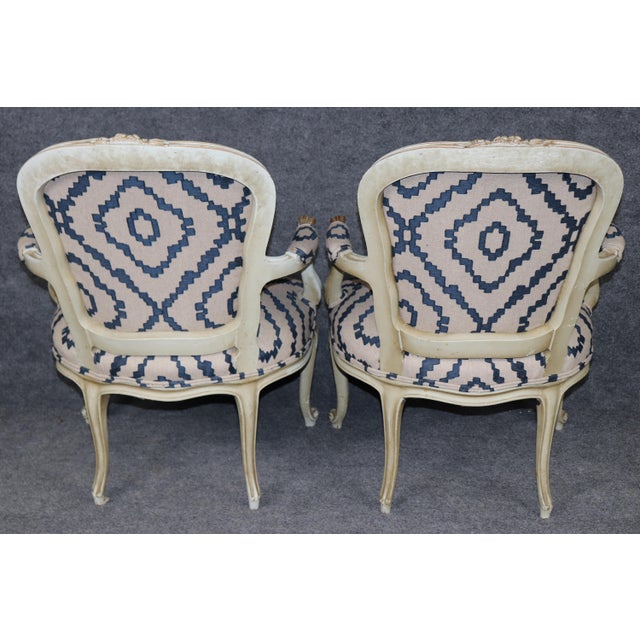 Add a touch of refined elegance to your home with this stunning pair of French Louis XV style armchairs, beautifully...