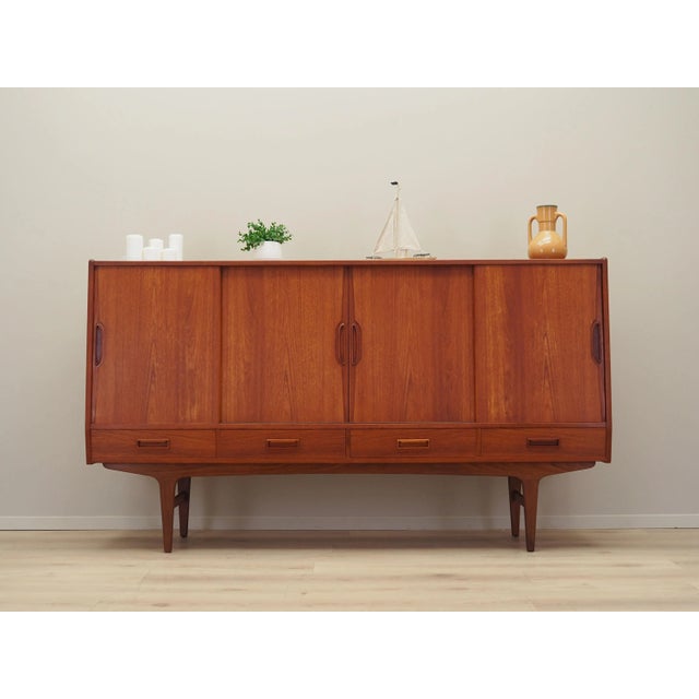 The highboard was made in the 1960s, designed by Danish design icon Børge Seindal. The structure is covered with teak...
