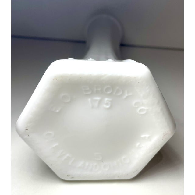 Vintage E.O. Brody Co. milk glass bud vase with ribbed design numbered 175. E.O. Brody Co. was a prominent glassware...