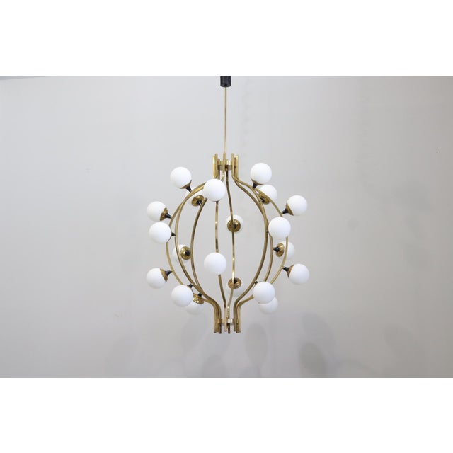 Large 20-Light Chandelier in Brass and Opal Spheres in the Stilnovo Style Up to 250V (Europe/UK Standard).The wiring of...