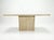 A classic 1970s Italian modern console table constructed of solid filled travertine. This piece features a two-part...