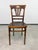 An elegant and highly collectible pair of Austrian/Central European Art Nouveau bentwood dining or side chairs...