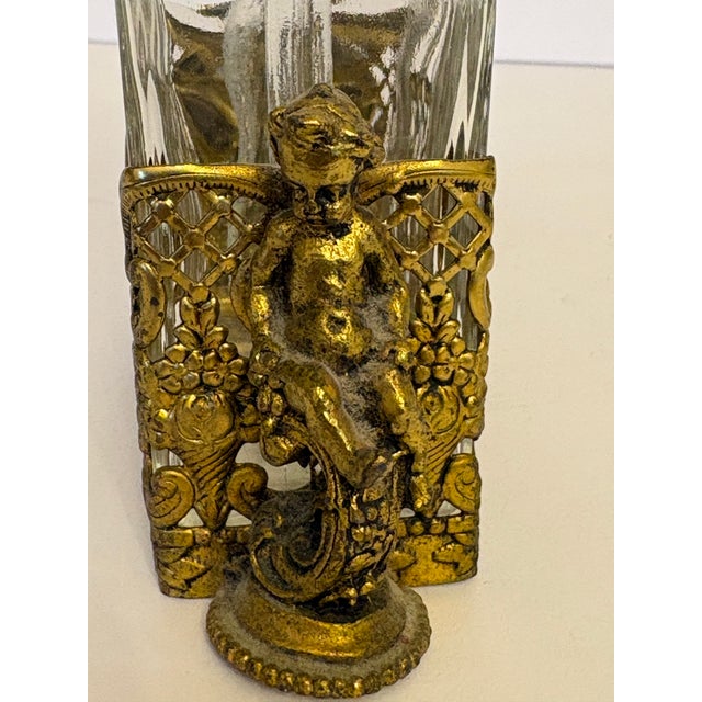 This set of French Baccarat style brass caddy and perfume bottles with stoppers are in excellent shape for being from the...