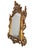 A handsome and richly carved pair of Baroque-style mirrors, finished in a warm, inviting gold tone. Each piece is framed...