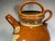This artisan-made, hand-thrown and hand-glazed French terracotta jug features an inscription that translates approximately...