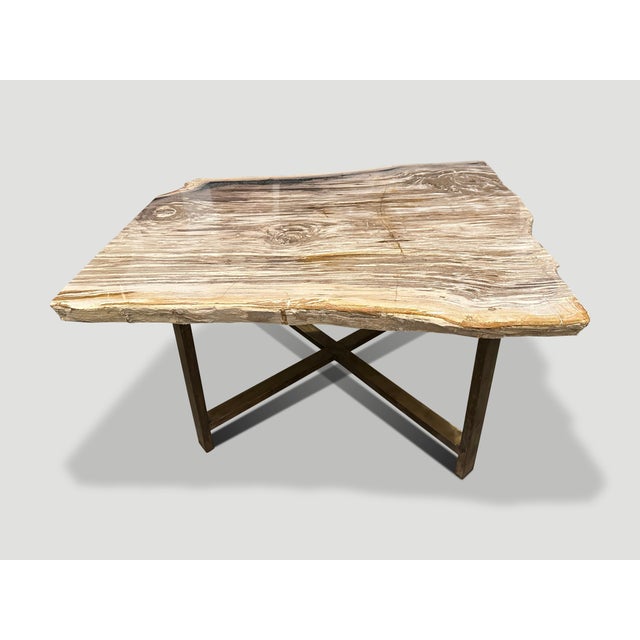 Impressive single two inch thick slab petrified wood coffee table, resting on a bronze base. It’s fascinating how Mother...