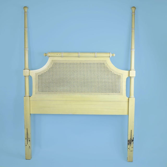 A pair of faux bamboo and cane headboards, twin size, with turned bamboo-style frames and airy woven cane panels. Sold as...