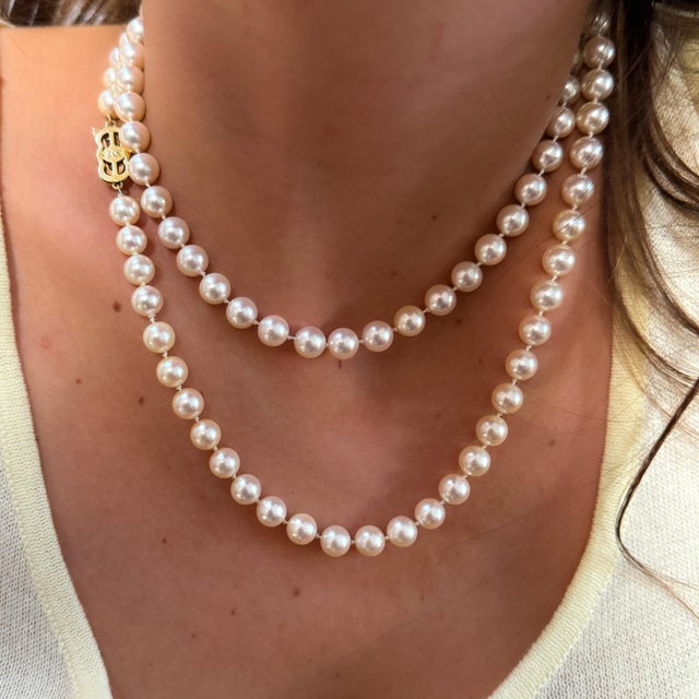 An elegant single strand of glowing Akoya cultured pearls from Mikimoto, this 33-inch necklace features a signature 18K...