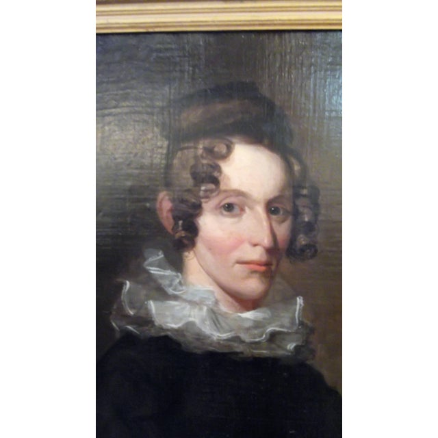 Oil on canvas, portrait of an aristocratic lady. The woman is sitting in a red armchair with a quiet gaze wearing...