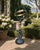A beautifully crafted armillary sphere featuring a mermaid and dolphin, evoking the timeless elegance of coastal or Palm...