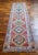 Elevate your hallway or kitchen island with this stunning 3x11 Ft long runner. Hand-knotted with vibrant colors, this...