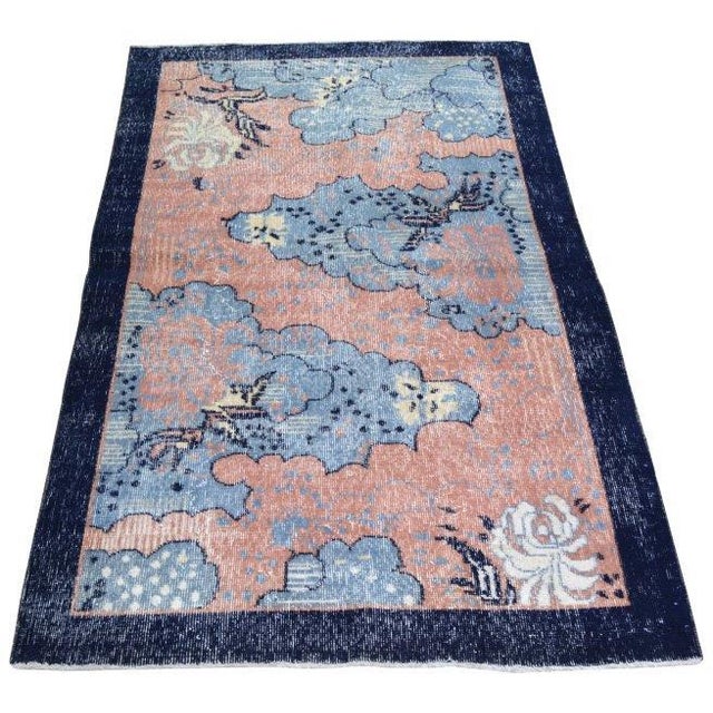 Hand-knotted with care using traditional rug making techniques, this wool rug blends timeless craftsmanship with a modern...