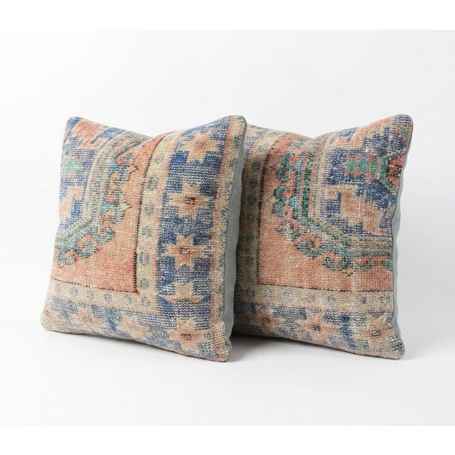 This beautiful 24'' x 24'' pillow cover set was made from authentic Turkish rug pieces. Bright colors of wool adorn the...