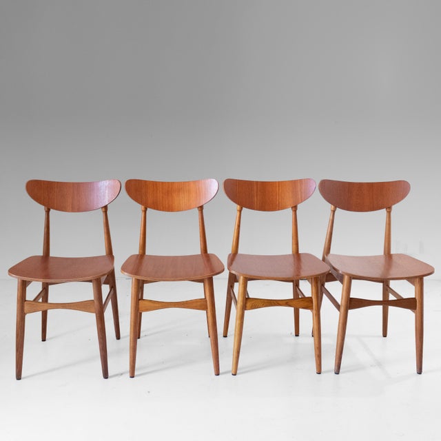 A beautiful and elegant set of four mid-century modern dining chairs, expertly crafted in Scandinavia during the 1960s....