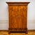 Two-door wardrobe with a straight carcass. The carcass is veneered in walnut. The doors display a mirrored veneer pattern....