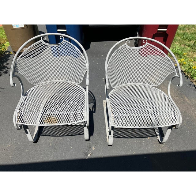 This pair of iron garden chairs is attributed to Russell Woodard They have been in a New England garden for over 50years...