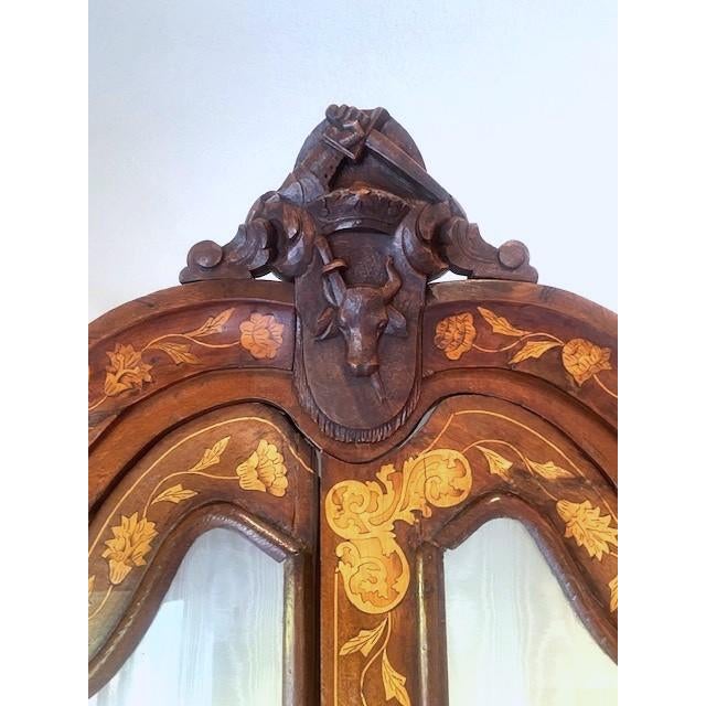 An original Dutch Marquetry Display Cabinet from the 1820's. Profusely decorated in the Dutch style. Bombe' style base...