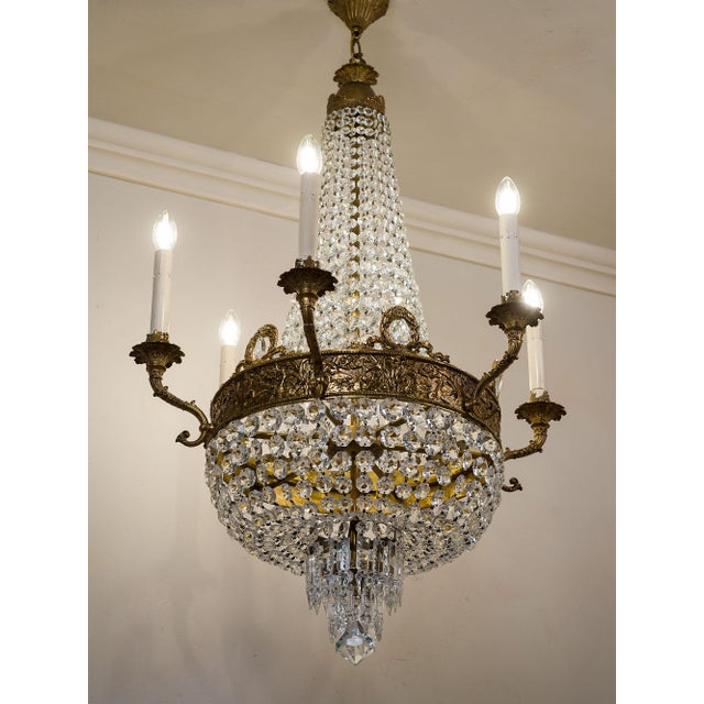 Empire-style chandelier in the shape of a hot air balloon, crafted from brass and decorated with glass and crystal drops....