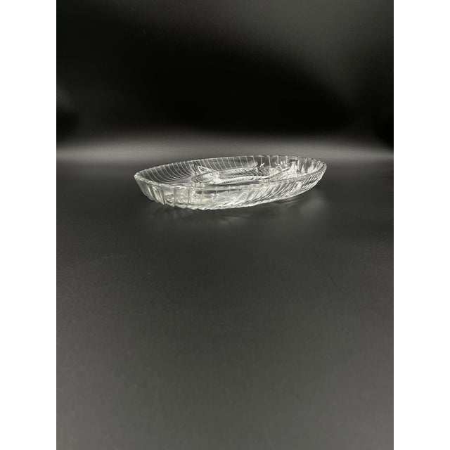 Vintage-style sectional platter, crafted from high-quality, thick glass. This transparent, oval-shaped platter features...