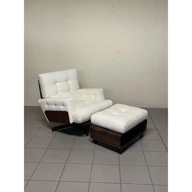 Splendid armchair with footrest, model 401, designed by Menilio Taro for Cinova in 1964. The set is distinguished by a...