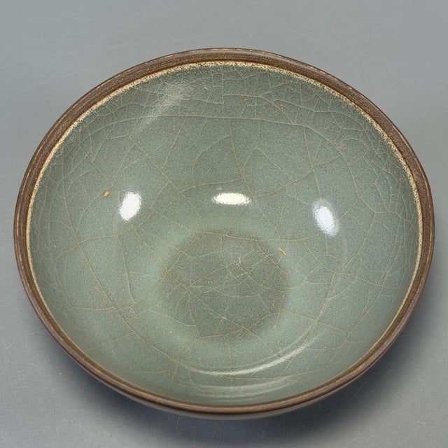Beautiful Chinese Longquan celadon bowl with natural crackle glaze. Elegant curved shape, subtle brown rim. A wonderful...
