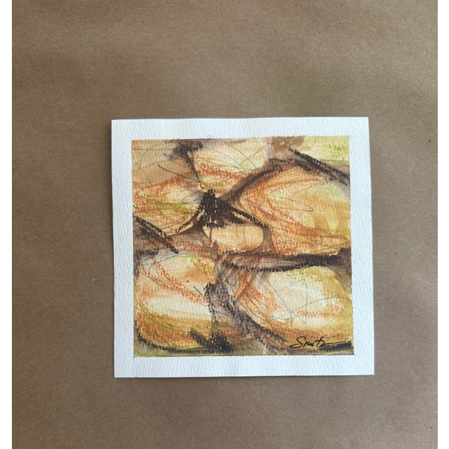 An expressive abstract study layered with warm ochres, sienna tones, and gestural charcoal-like marks. Organic movement...