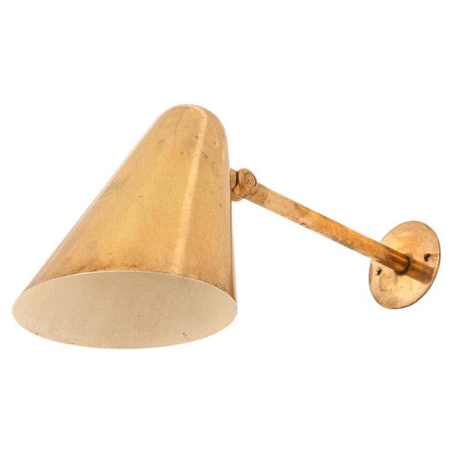 This set of brass wall lamps, produced by louis poulsen in denmark, embodies the enduring elegance and craftsmanship that...