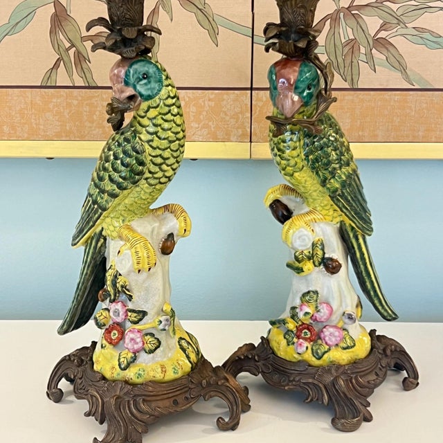 This is a beautiful pair of vintage hand-painted ceramic birds mounted on bronze bases and with bronze candle holders...
