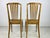 A pair of Louis XVI style side chairs in a slight golden oak finish with tall back with an arched crest rails, five...
