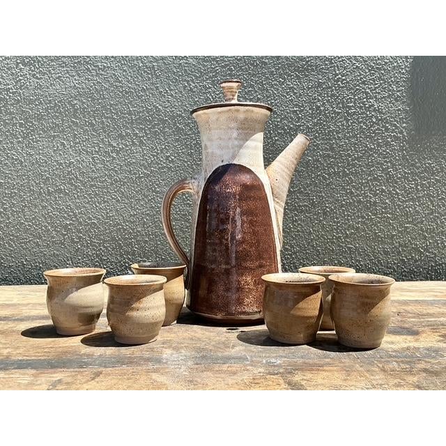 This exquisite six-piece studio pottery set showcases a masterful blend of Mid-Century Modern aesthetics and organic...