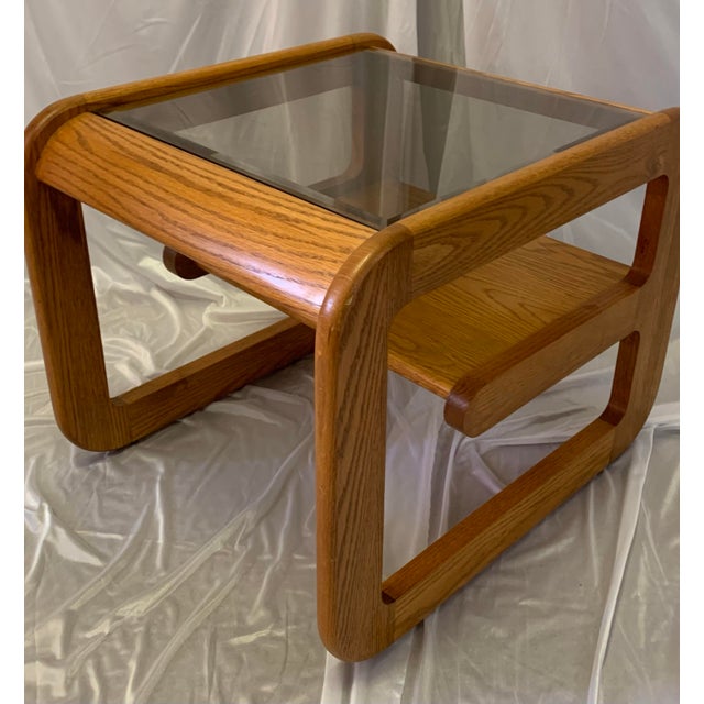 This style of oak side table is often attributed to designer Lou Hodges, but was made by Mersman - a prominent and high...