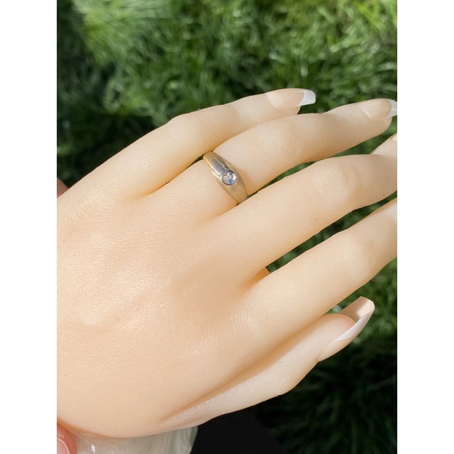 The Russellville: Children's Diamond Ring in Yellow gold. The ring features a central old single cut round natural...