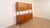 A beautiful and unique vintage open cabinet, crafted from warm teak. A piece of furniture with a striking and highly...