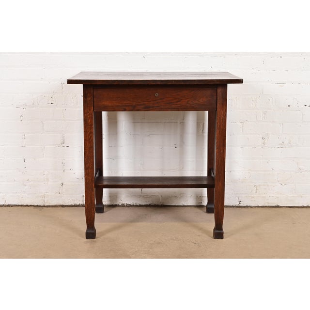 A gorgeous antique Mission or Arts & Crafts period quarter sawn oak writing desk or library table In the manner of...