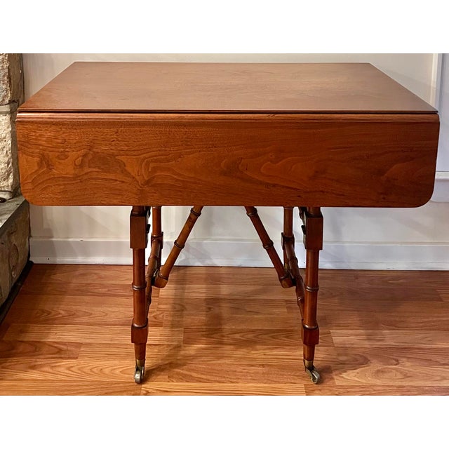 Regency styled bamboo turned convertible drop leaf table. This gem of engineering is a fully functional drop leaf dining...