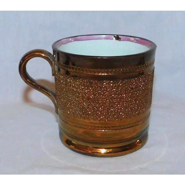 Antique English copper luster child's mug with gravel band and pink luster rim, c. 1850