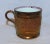 Antique English copper luster child's mug with gravel band and pink luster rim, c. 1850