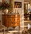 Exquisite 19th-century French Louis XVI-style demi-lune cabinet featuring intricate floral marquetry inlay, a beautifully...