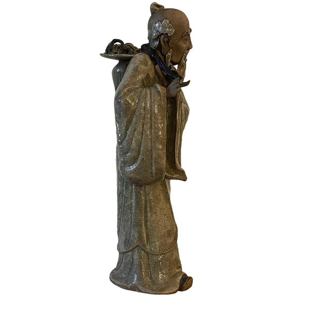 Refined ceramic sculpture, decorated and glazed, Chinese. In good general condition, the fingers are unfortunately damaged...